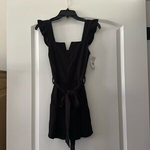 Black romper with ruffle sleeves